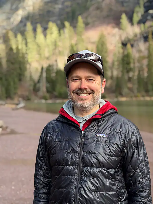 Jake Bramante, founder and owner of Hike 734 after hiking to Avalanche Lake in Glacier National Park