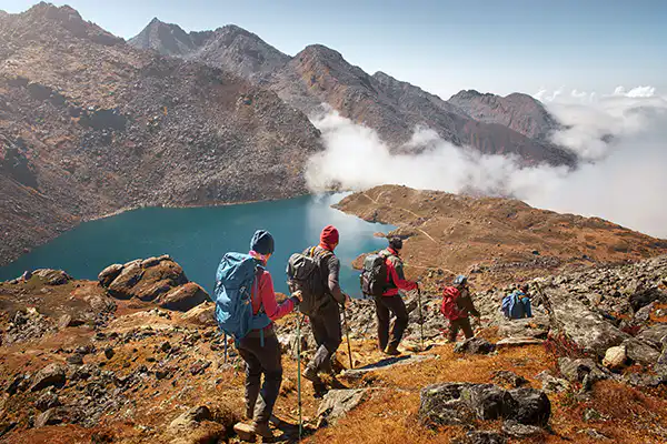 Group of hikers descending a hiking trail